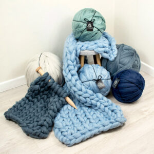 arm knitted blanket with arm knitting yarn balls 